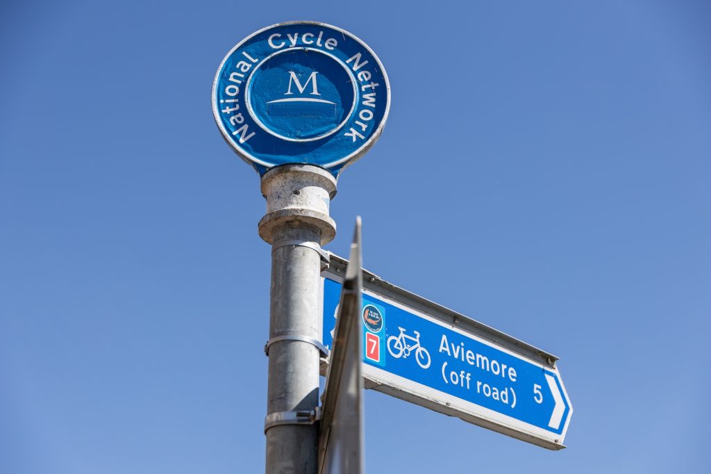 Cycle route signpost for National Cycle Network Route 7 to Aviemore (off-road)